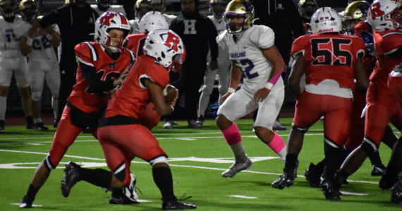 Renton High QB Jesse Holmes running the read option against the Pirates of Highline. Photo by Ben Ray/Sound Publishing