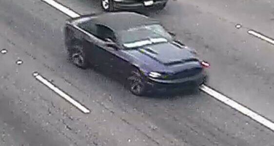 The suspect the shooting of a 9-year-old boy is still at large, last seen driving this stolen dark blue Ford Mustang convertible. The vehicle was recovered in Tukwila on Nov. 20. Photo courtesy of Washington State Patrol.