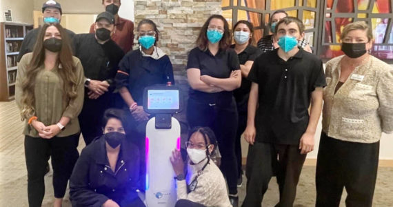 Dubbed R2D2, the Segway Servebot S1 picks up orders and delivers them to tables and even helps with bussing, allowing the GenCare staff more time to interact with residents. Photo courtesy GenCare Lifestyle