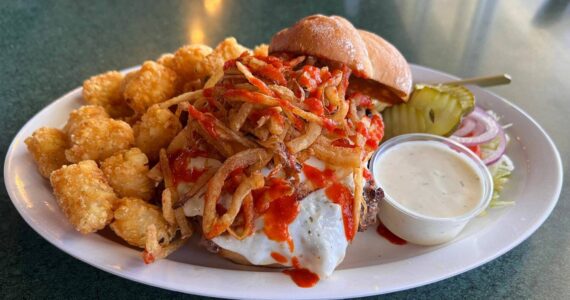 The Master Blaster Burger ($17.95) topped with pepper jack cheese, fried onions, a fried egg & drizzled with sriracha. Cameron Sheppard/ Renton Reporter