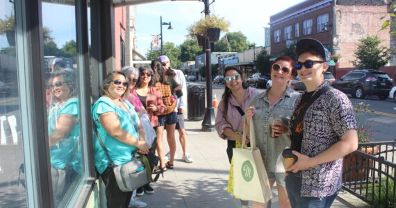 Patient customers wait in line for over an hour for Macadon's anniversary celebration. Photo by Bailey Jo Josie/Sound Publishing.
