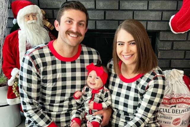 Dr. Alana Curatola and her husband and baby in December of 2022. (Courtesy of King County Superior Court documents.)