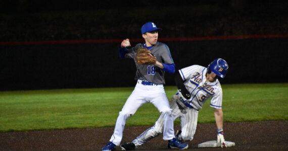 Jack Warren fought through contact from Hazen's Morrie Solam. Ben Ray / The Reporter