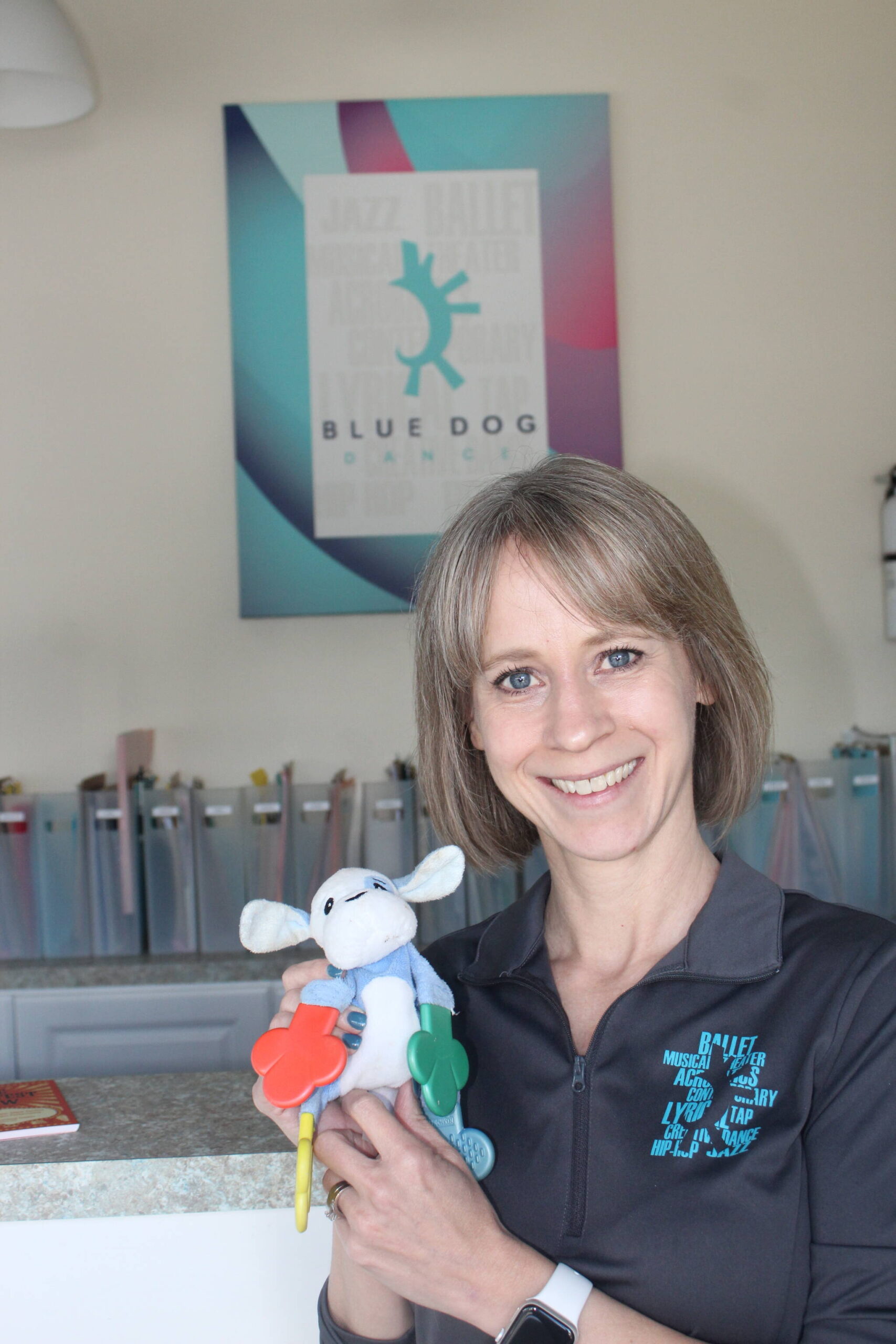Blue Dog Dance founder Barbara Walshe holds her daughters’ toy that inspired the name of her dance studio. Photo by Bailey Jo Josie/Sound Publishing.