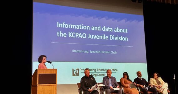 Renton Police Department’s Meeghan Black speaks at the 2024 community safety forum with (from left) Chief Jon Schuldt, Jimmy Hung, Veronica Galván, Randy Matheson and Katya Wojcik. Photo by Joshua Solorzano/The Reporter