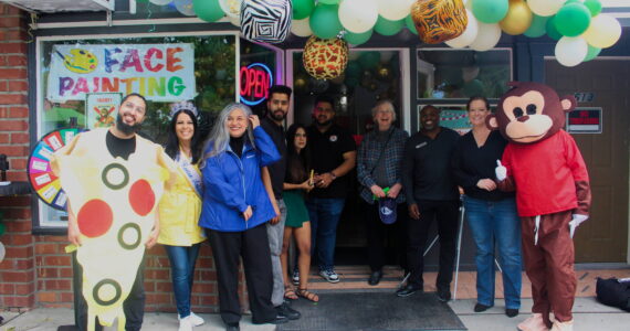 The Renton Chamber of Commerce and Renton City Council members celebrate Smoking Monkey Pizza’s 10-year celebration. Photo by Bailey Jo Josie/Sound Publishing.