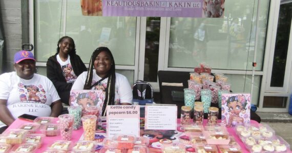 From left to right: Ashley Scott and her daughters Sandria and KJ Scott at the Keatious Bakin & Kakin LLC booth. Photo courtesy of Annika Hauer