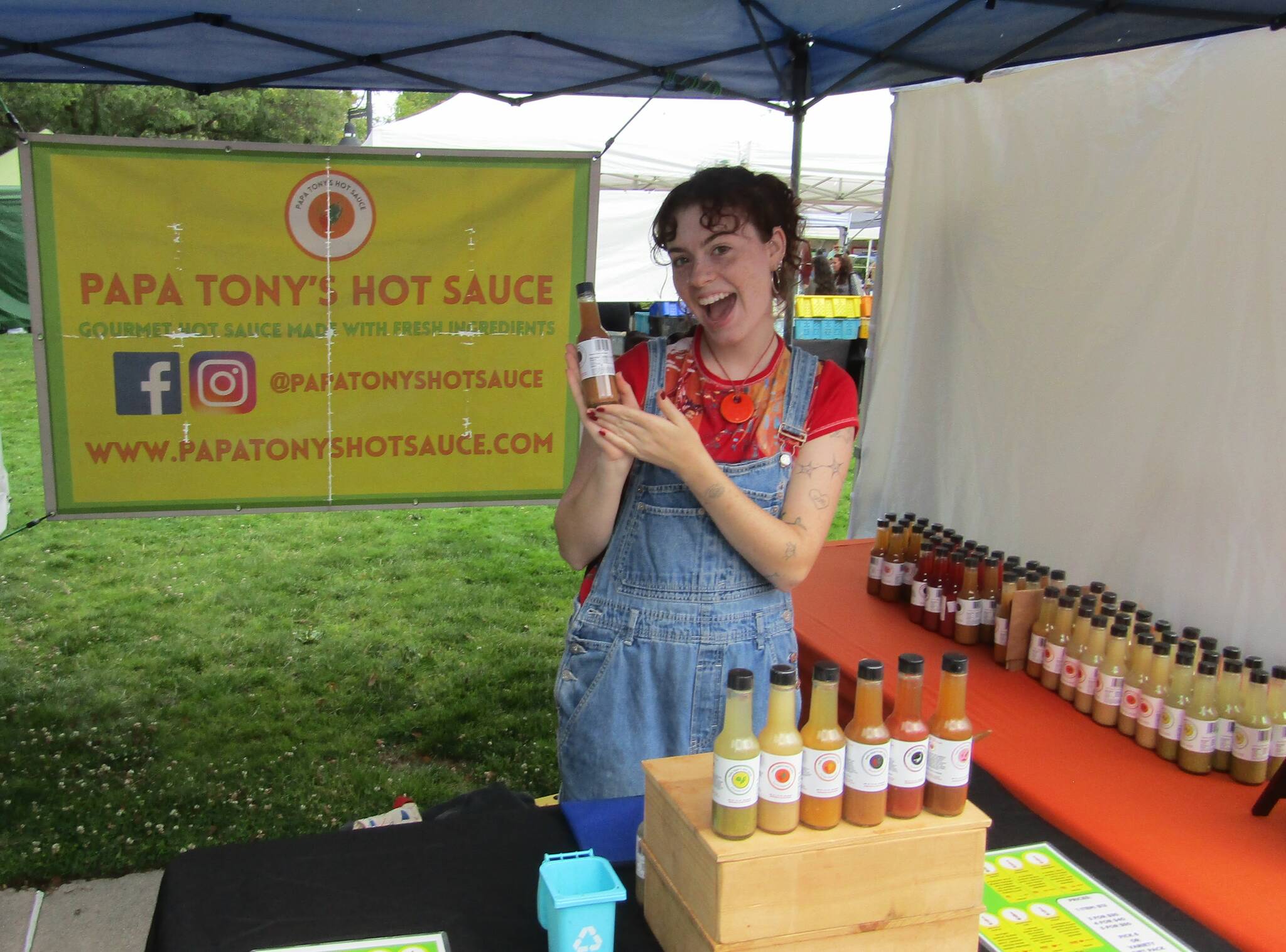Raine Padawer, employee of Papa Tony’s, with her favorite flavor of hot sauce, the Ghostly Garlic. Photo courtesy of Annika Hauer
