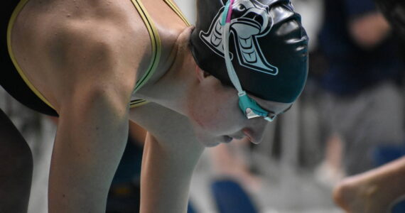Sophie Buchan preps for her 200-freestyle race at state. Ben Ray / The Reporter