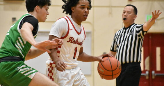 Ben Ray / The Reporter
Renton’s Jordan Agosto fends off a Woodinville defender.