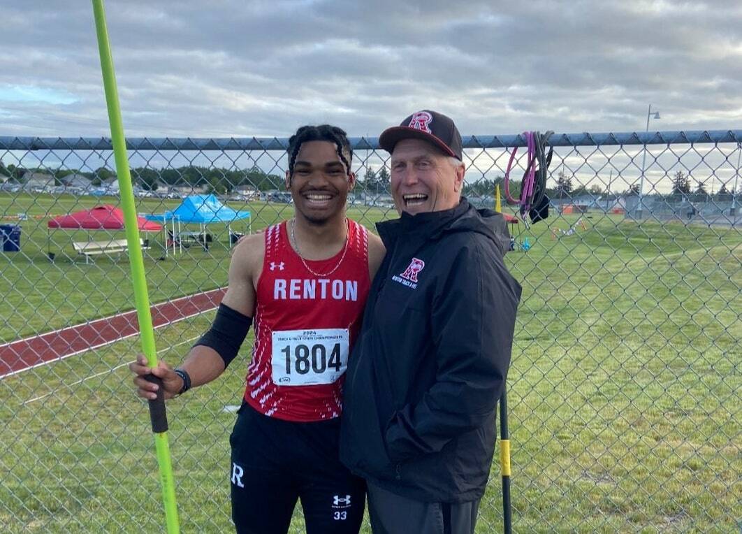 Demond Williams Jr. and Keith Eager after Williams won javelin at the state tournament. Courtesy photo.