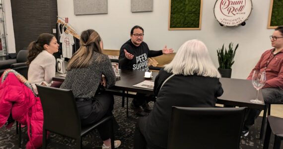 Joaquin Delgado was the guest speaker at the monthly Renton Reporter Read All About It chat night, where he spoke about his work with Peer Kent and how he helps people going through the local court system. The next Read All About It night will be Tuesday, Feb. 25, at Drum Roll Wine in downtown Renton. Photo by Bailey Jo Josie/Sound Publishing.