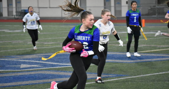 Alison Frank makes a catch and runs the ball upfield. Ben Ray / The Reporter