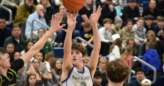 Max Vermeulen takes a three-pointer in the win over Bishop Blanchet. Ben Ray / The Reporter