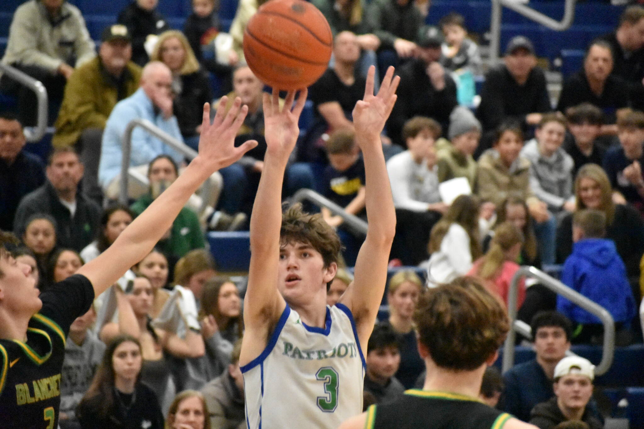 Max Vermeulen takes a three-pointer in the win over Bishop Blanchet. Ben Ray / The Reporter