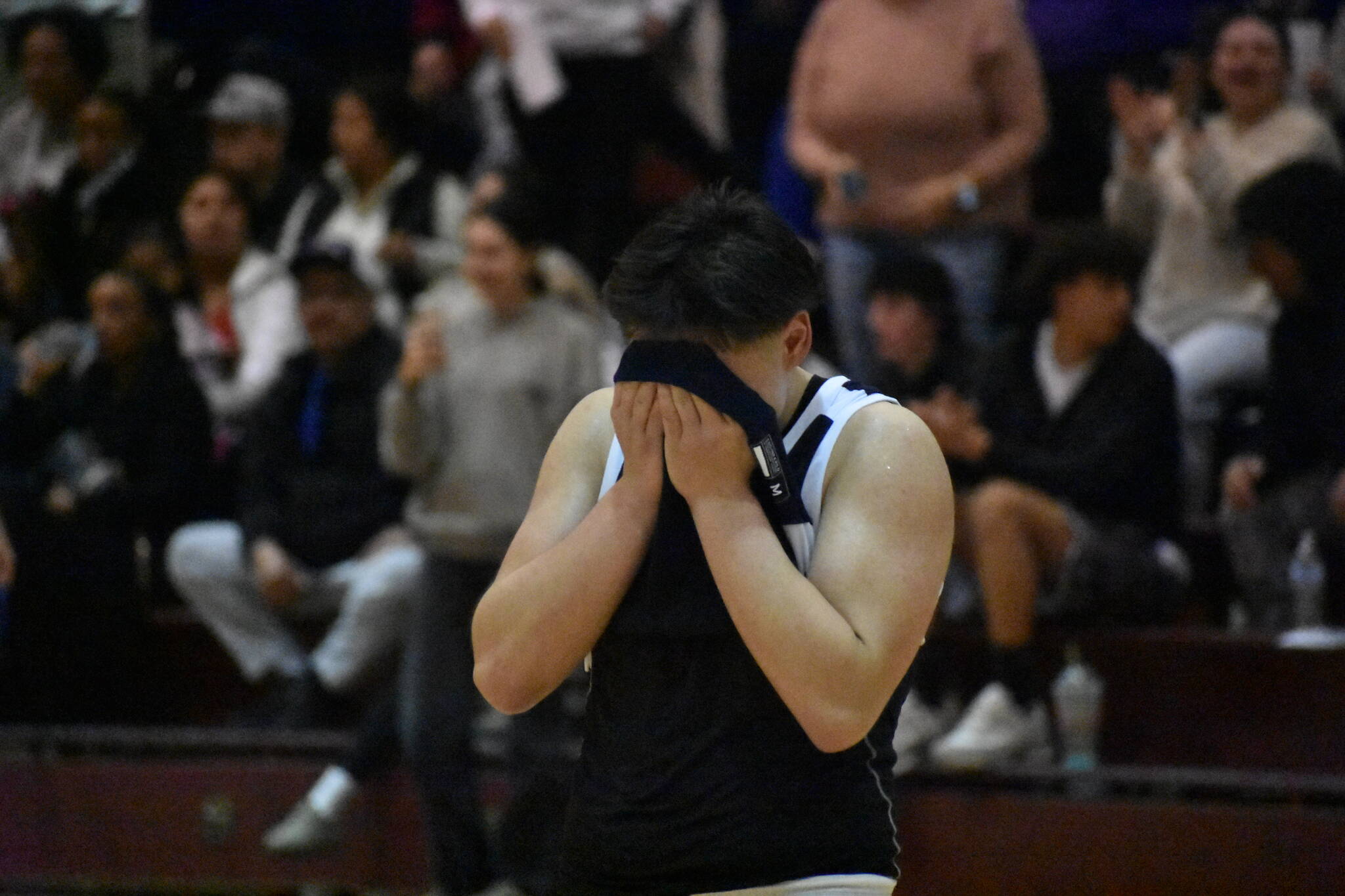 Trinidad Valentino English covers his face after falling to Sequim in the state tournament. Ben Ray / The Reporter