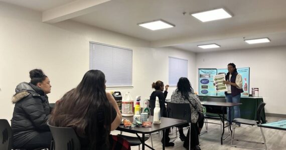 Hazardous Waste Management Program Educator Consultant Chelsea Hicks teaches a workshop about the dangers of certain cleaning products to residents. Photo provided by Meara Heubach