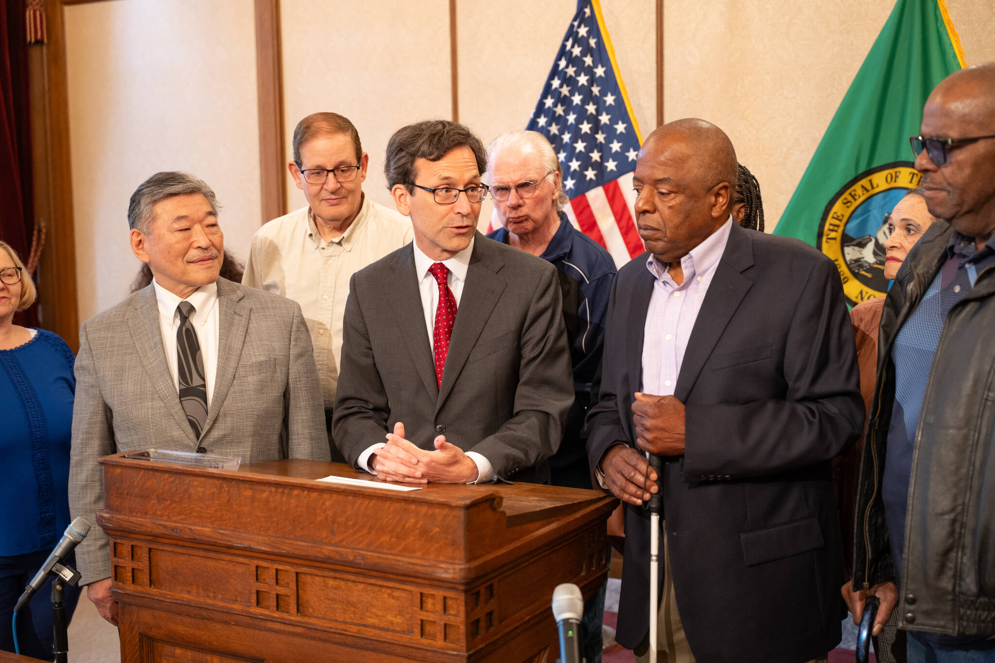 John Houston, right, as Gov. Bob Ferguson signs the bill into law. Photo courtesy of the Washington State Governor’s Office.