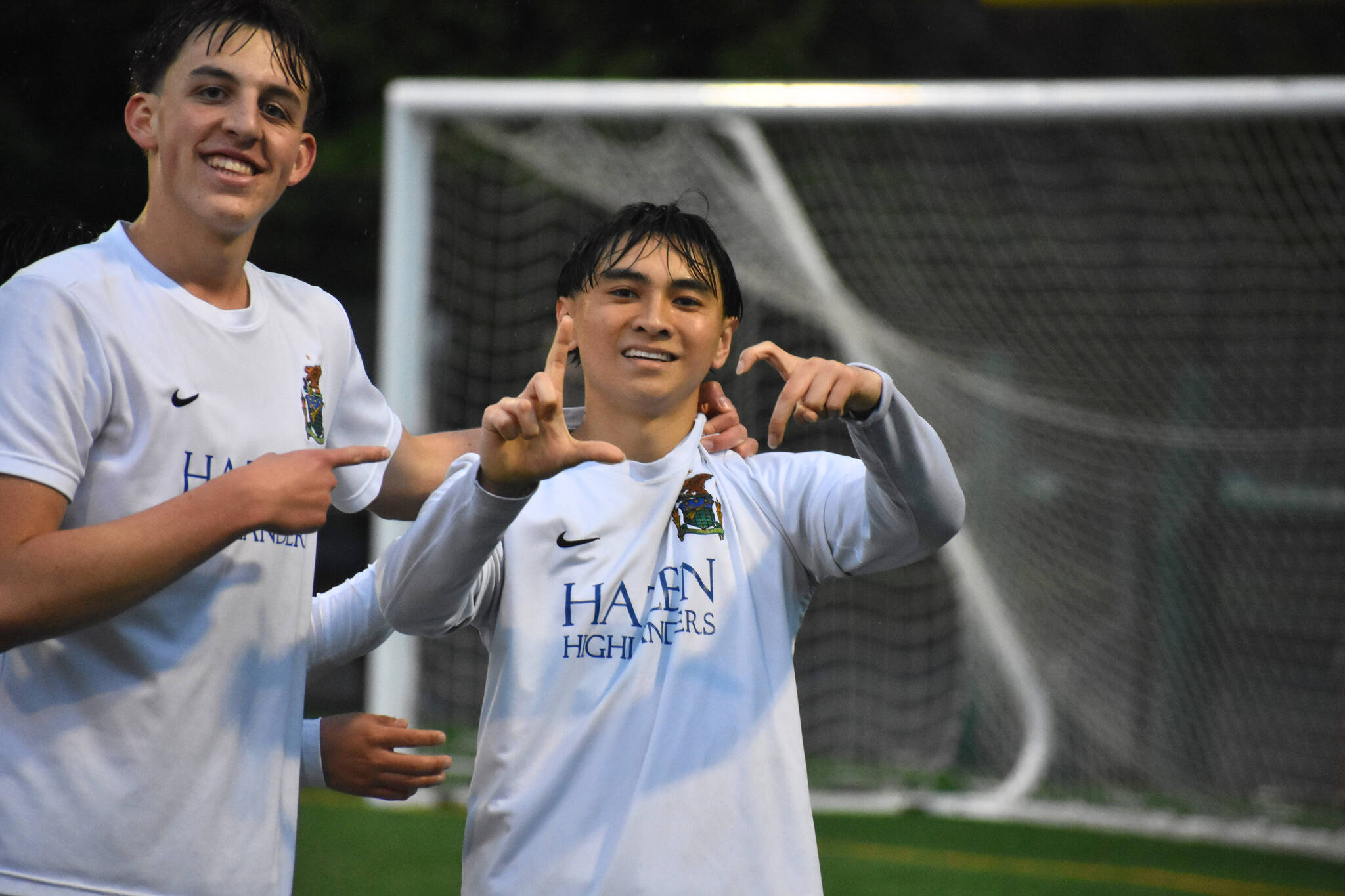 Niko Uzelac and Nathen Song celebrate the first goal for Hazen. Ben Ray / The Reporter
