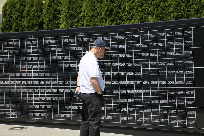 A man reads the names of U.S. veterans at Renton’s Veterans Memorial Park. Photo courtesy of the City of Renton