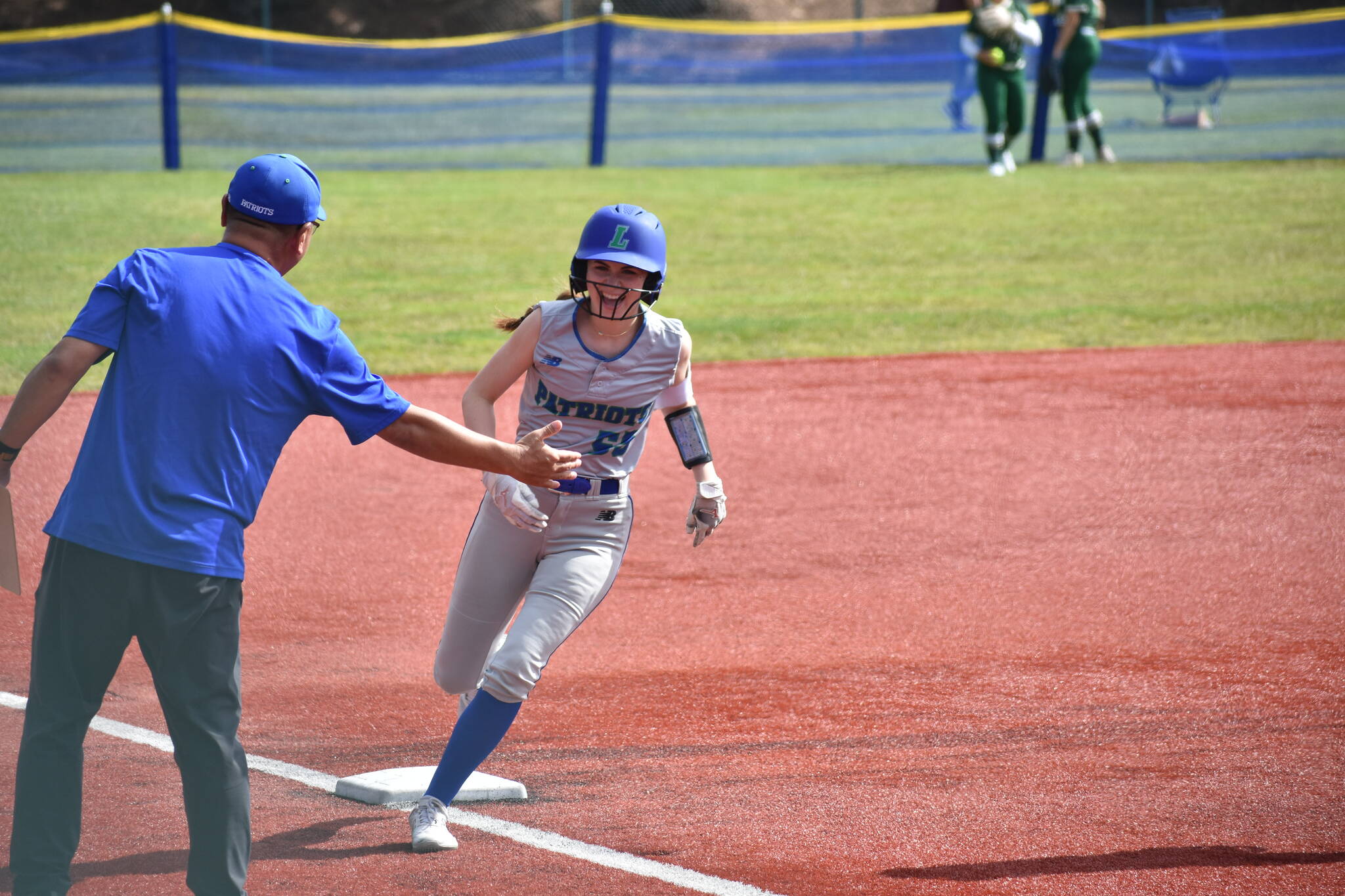 Berlyn Crockett circles the bases after hitting a home run in the first game of the state tournament. Ben Ray / The Reporter