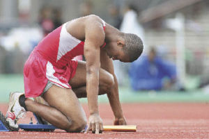 Renton’s Marquez Croon awaits the “set” signal at the start of the 4x100 relay in a meet at Renton Memorial Stadium April 3.