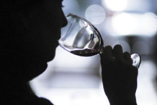 Meggie von Haartman of Renton sips wine at a tasting at All Things Wine in the Renton Highlands.
