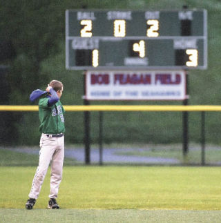 Liberty’s Troy Colyer looks at the scoreboard in the Patriots’ 6-3 loss to West Seattle Tuesday.