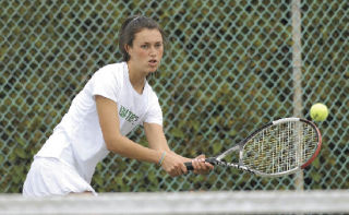 Kelly Lank of Hazen High School returns a shot in her doubles match against the team from Auburn Riverside High School. Her doubles teammate was Angie Wnek.
